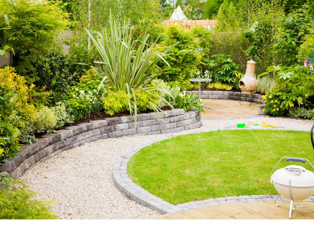 lush green garden with a large flax as focal point